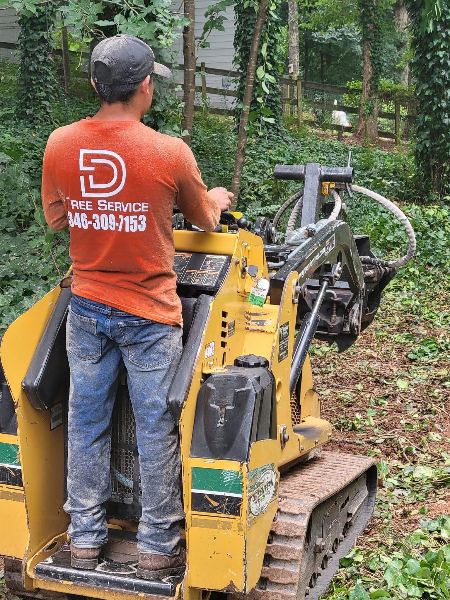 Operator running stump grinding equipment